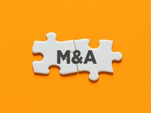 M&Aと書かれたパズルのイメージ